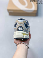 Rear view of the Asics sneaker showing the GEL heel branding, layered heel panels, and outsole.