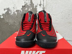 Front view of red and black Nike Flight sneakers with red laces and white midsoles