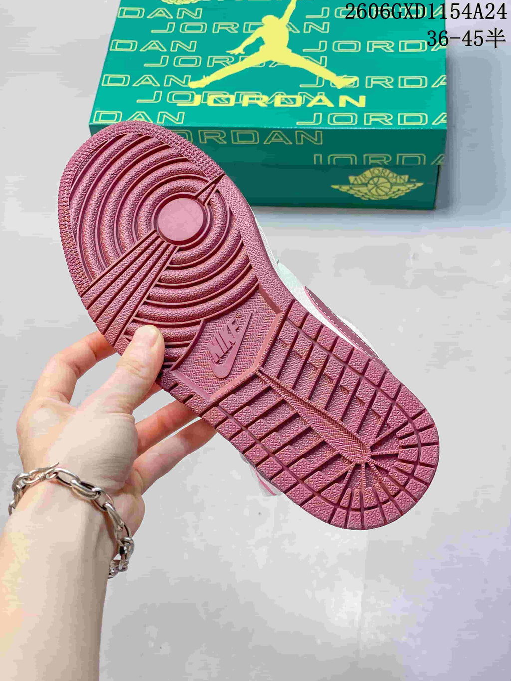 Close-up of the burgundy outsole on an Air Jordan 1 Low sneaker