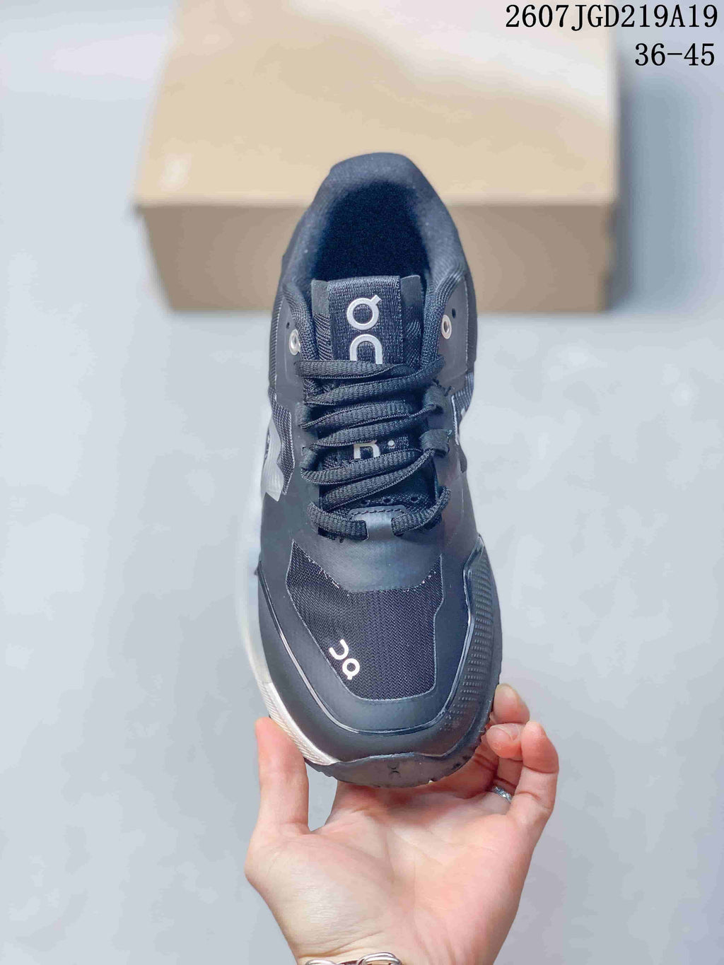 Top view of the black lace-up shoe showing the tongue, eyelets, laces, and contrasting branding; style code 2607TGD219A19 and size range 36-45 are visible.