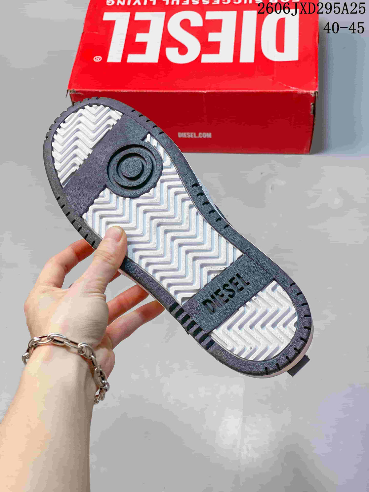 Close-up of the sneaker outsole with a patterned tread and Diesel wordmark