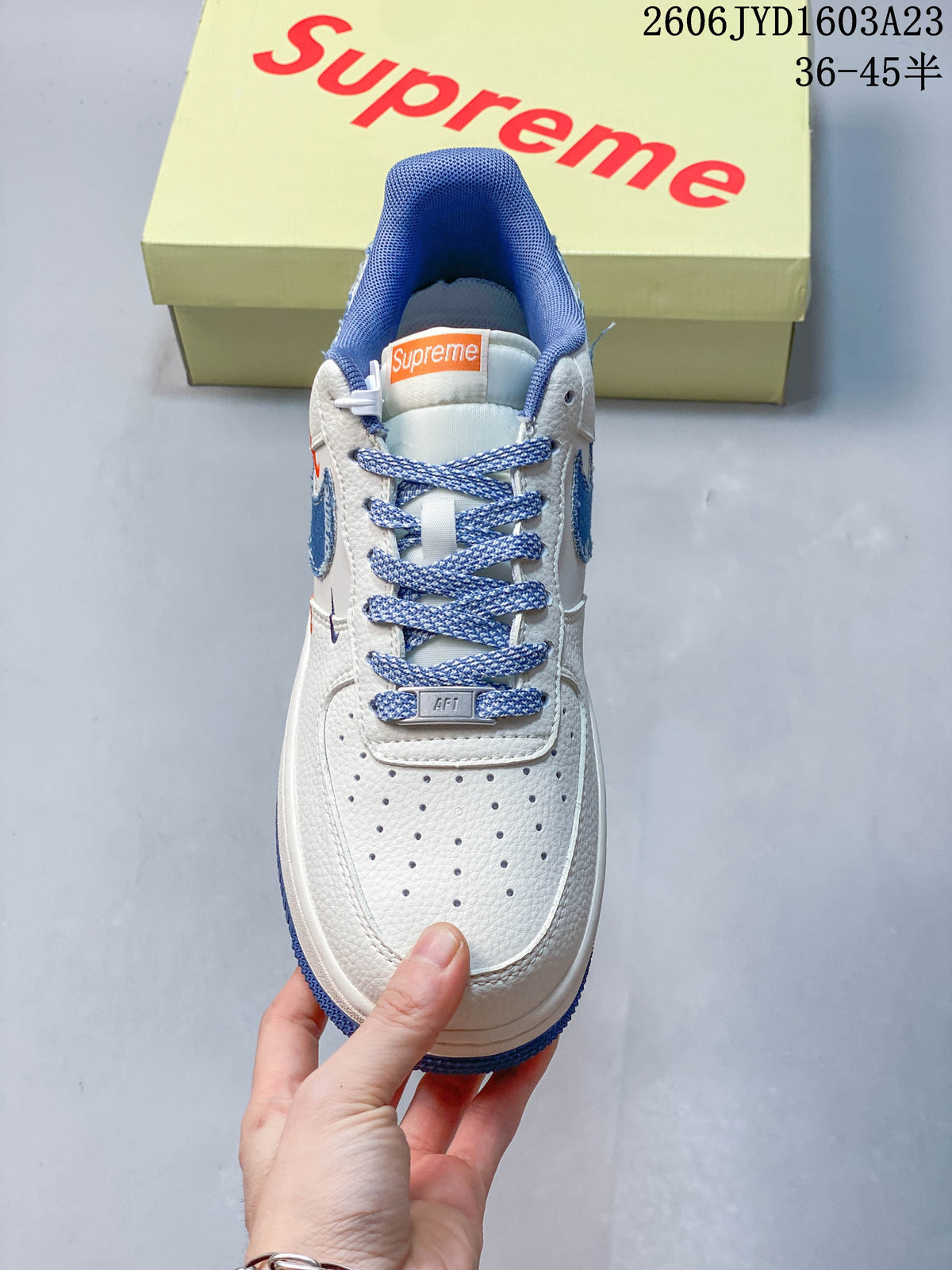 Front view showing perforated toe, blue laces, and blue collar lining