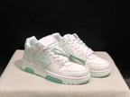 Three-quarter view of the pair highlighting the white upper, pale mint side accents and lace-up construction.