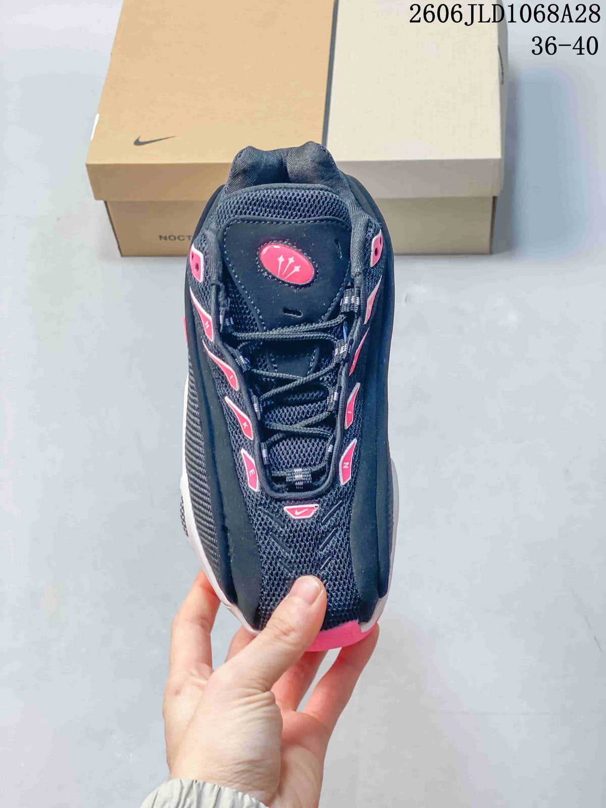 Top view of the sneaker showing its lace-up front and pink detailing