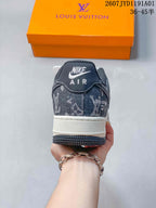 Rear view showing the dark patterned heel panel and white midsole