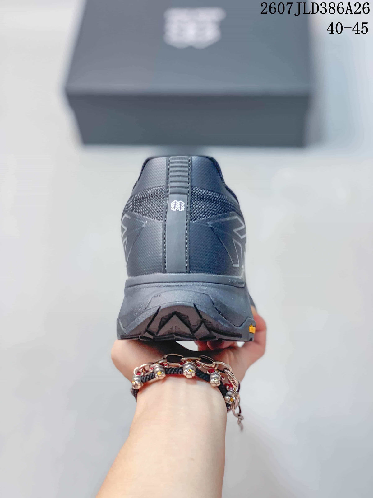 Rear view of the hiking shoe showing the heel construction, central pull detail, and patterned outsole.