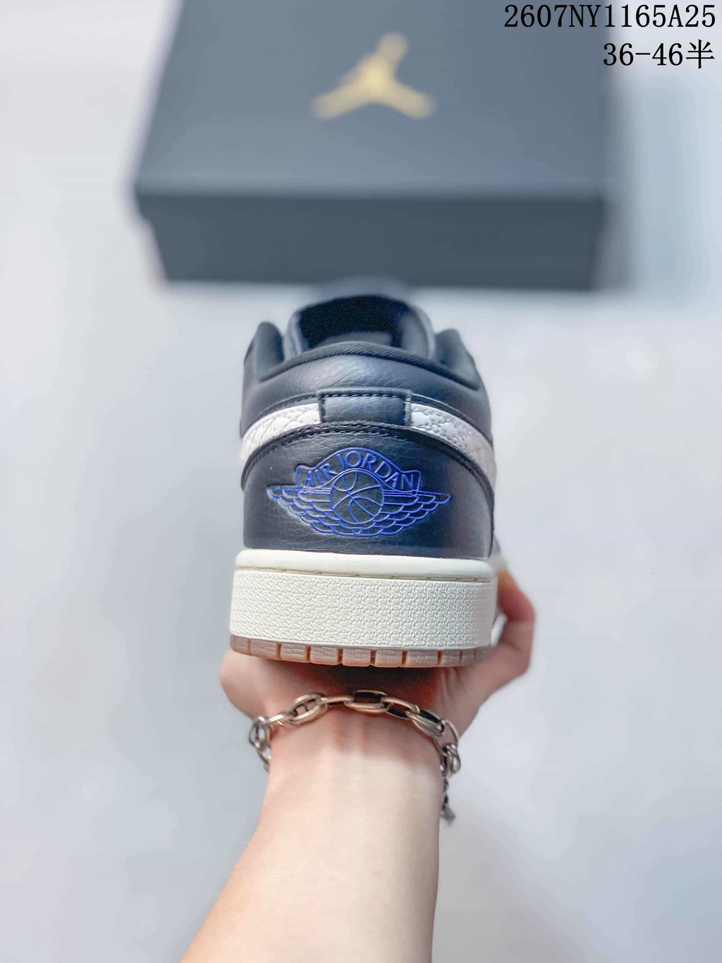Rear view showing the Jordan Wings emblem and layered heel construction