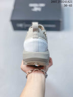 Rear view showing the heel pull tab, layered heel counter, and lugged outsole.