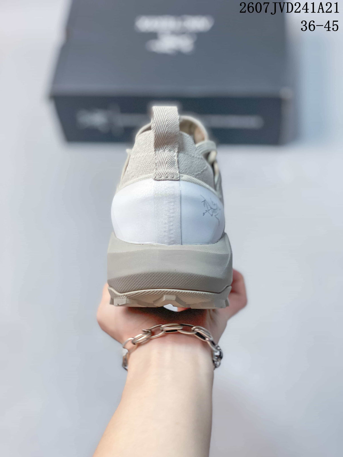 Rear view showing the heel pull tab, layered heel counter, and lugged outsole.