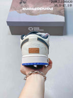 Rear view of the off-white sneaker showing heel graphics and blue outsole.