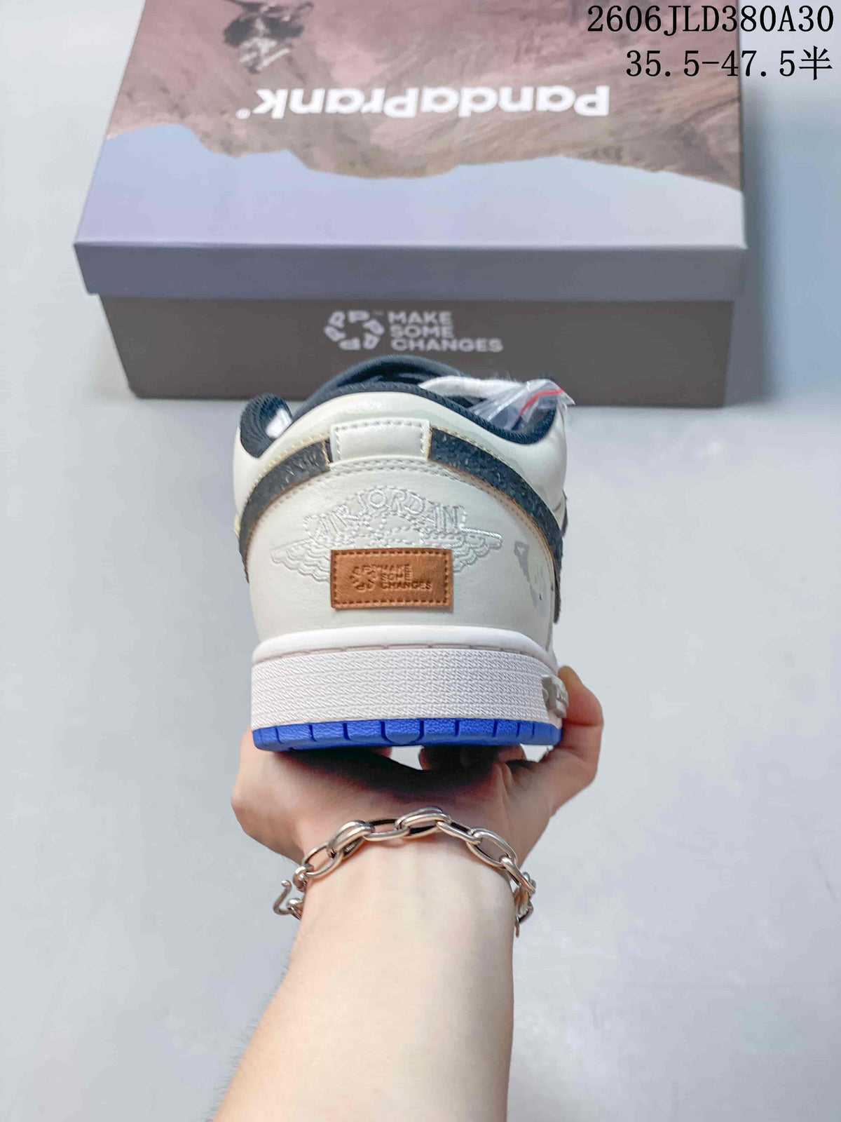 Rear view of the off-white sneaker showing heel graphics and blue outsole.