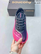 Top view of a navy and pink Saucony running shoe with dark laces