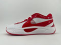 Side view of a white and red Nike low-top sneaker with white laces and a sculpted white midsole.