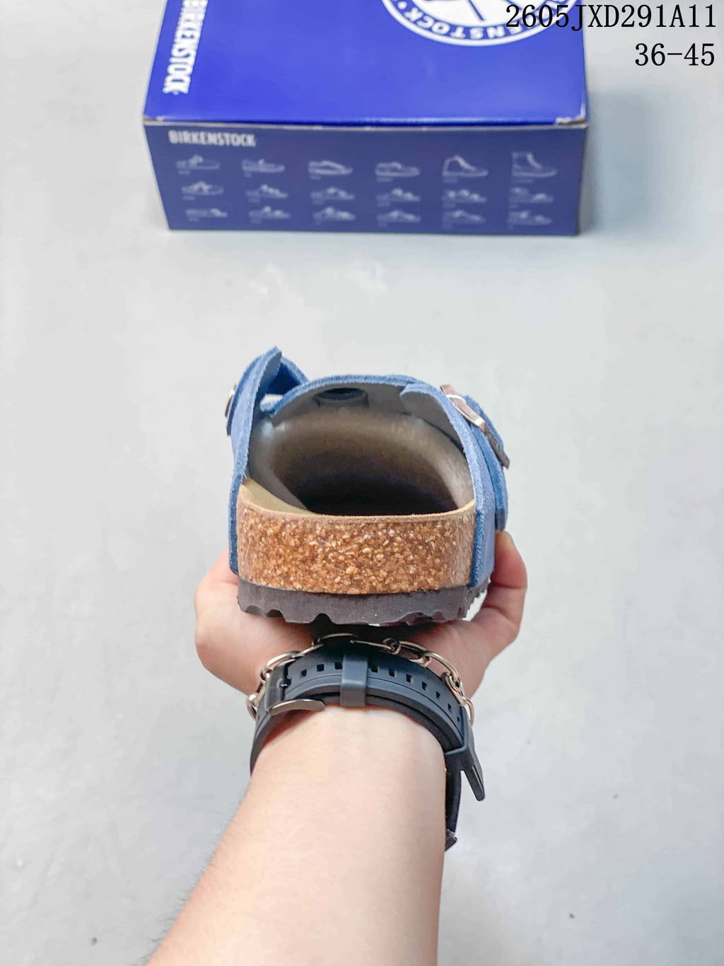 Rear view showing the open-back design, contoured footbed edge, and textured outsole.