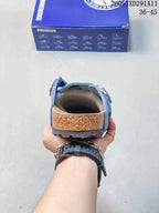 Rear view showing the open-back design, contoured footbed edge, and textured outsole.
