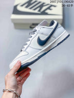Side profile highlighting the off-white upper, dark Swoosh, patterned laces, layered panels, and low-top shape.