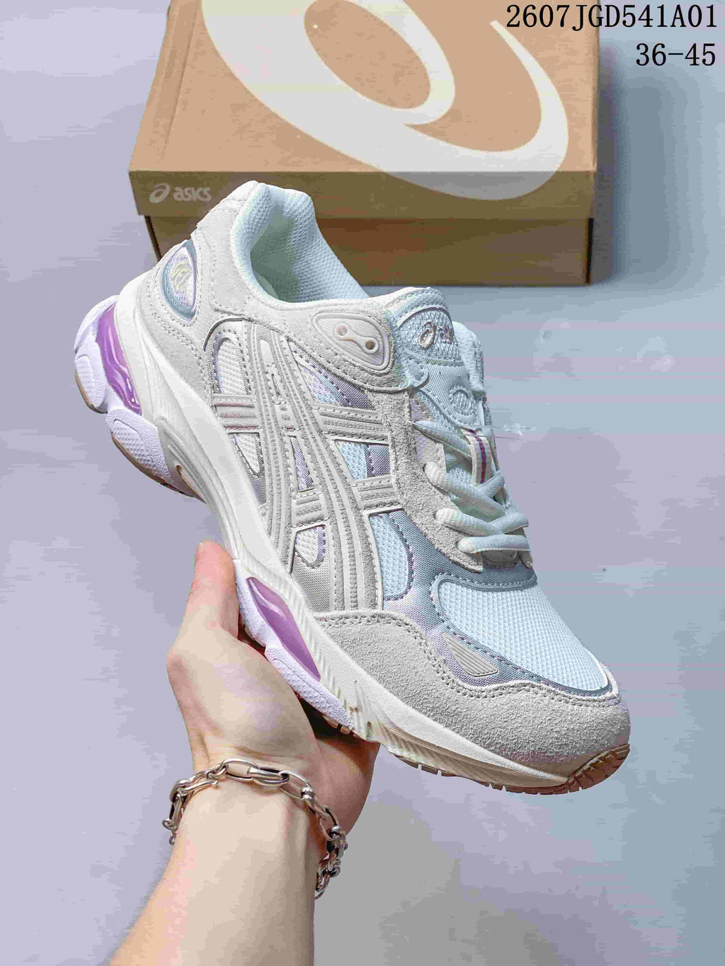 Angled side view of the white and silver ASICS GEL-NYC 2.0 sneaker