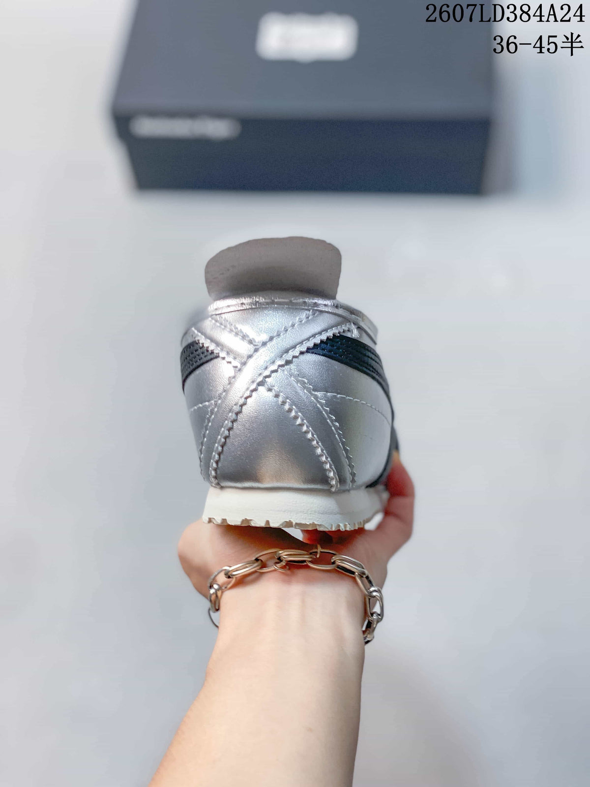 Rear view showing the silver heel, black stripe detail and white sole.