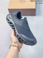 Close-up of a dark gray Galah slip-on shoe showing its upper and sculpted sole.