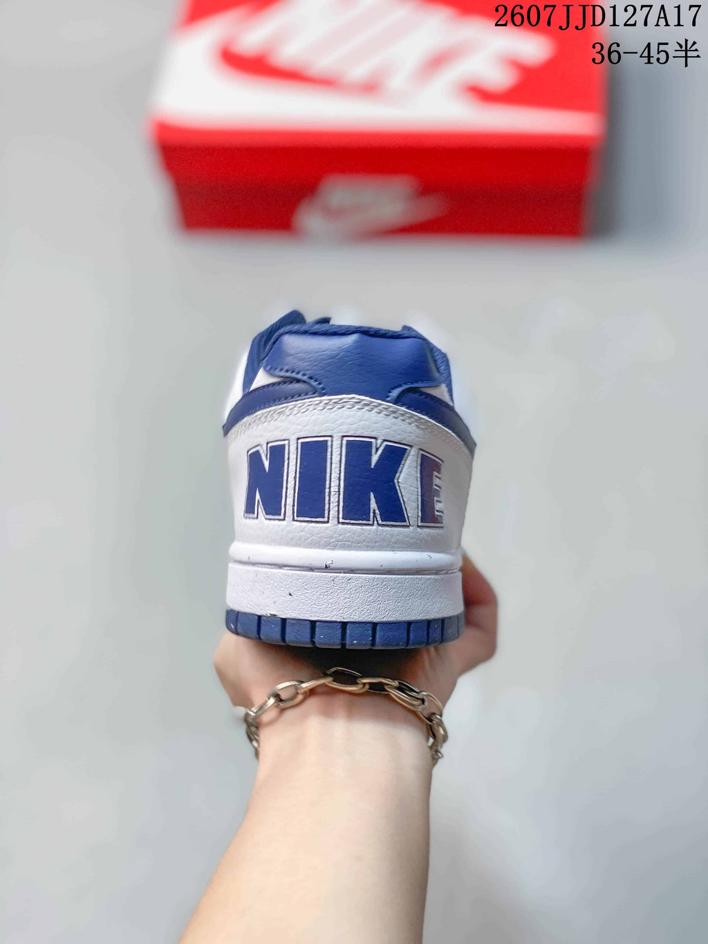 Rear view showing the Nike branding, navy heel and white midsole.