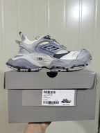 Side view of the all-grey sneaker resting on its box; the box label shows CARGO, SUEDE/MESH/W, ALL GREY, and size C 37.