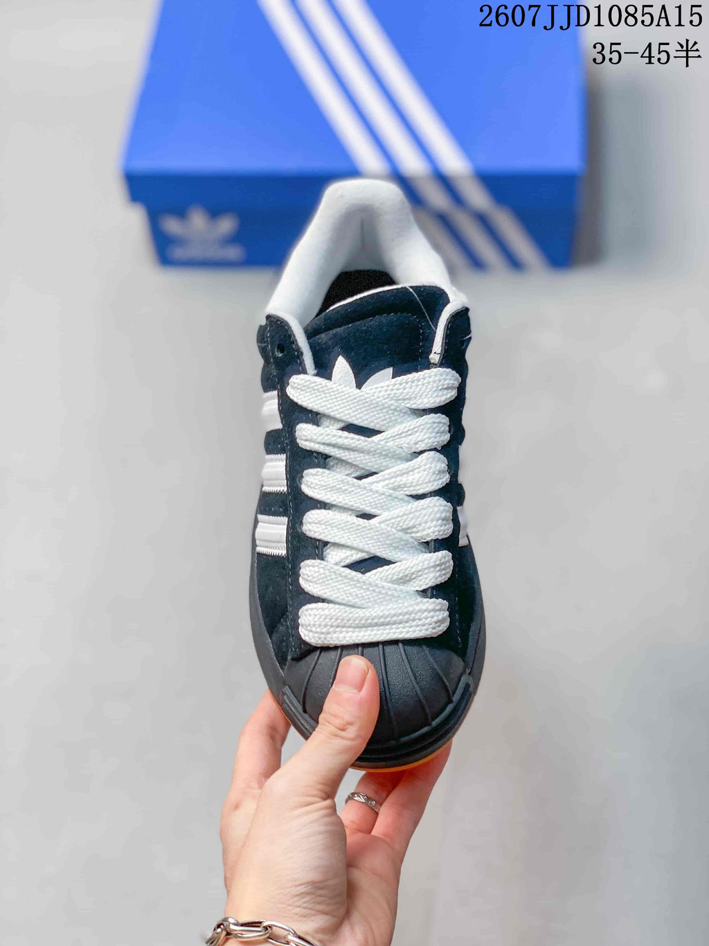 Top view showing the white laces, black shell toe, and padded white collar.