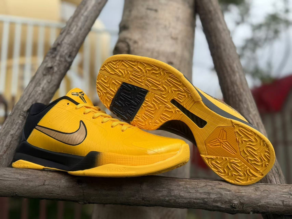 Yellow patterned outsole and side profile of the Kobe 5 shoes.