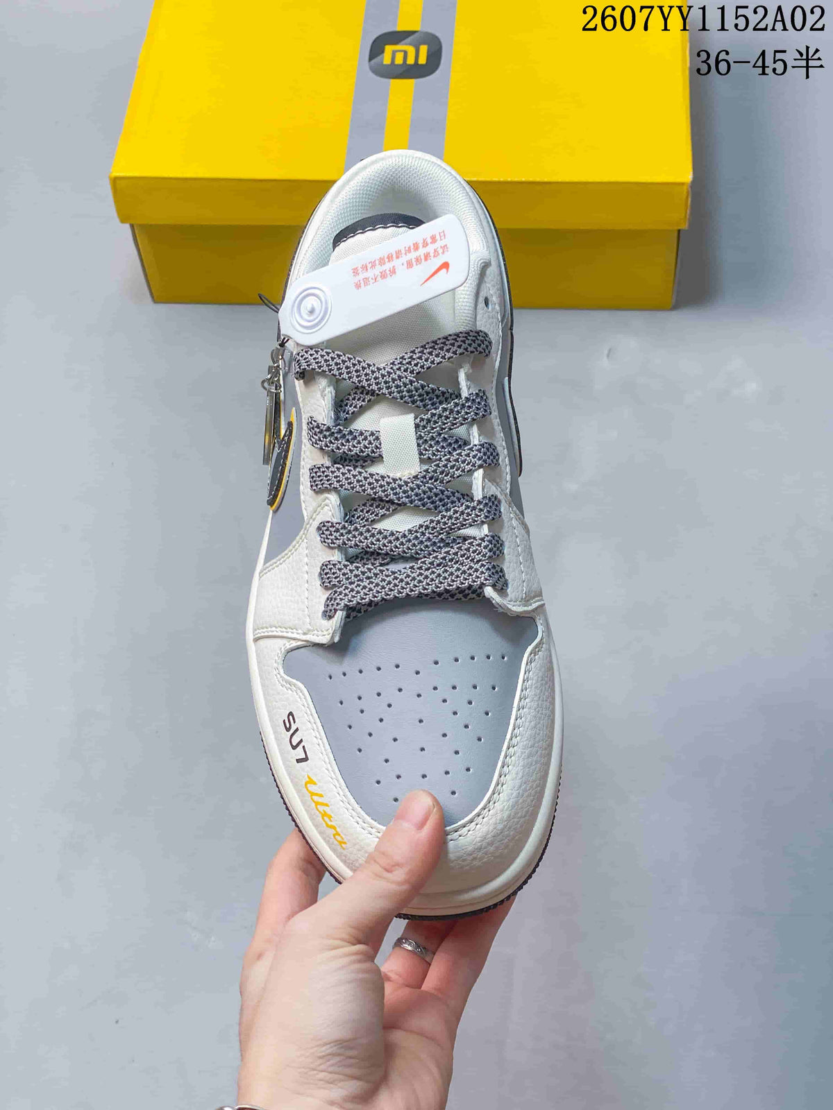 Top view showing perforated toe panel and patterned laces