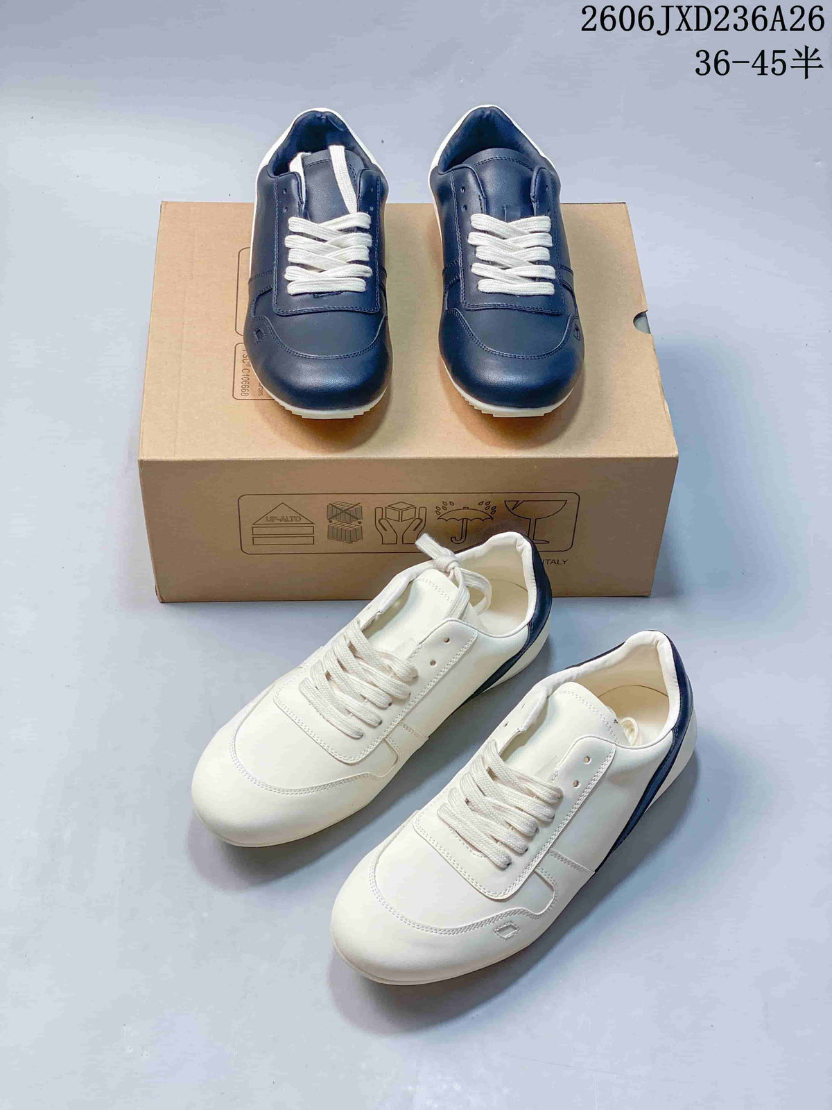 Navy and white colorways of low-top lace-up sneakers shown together.