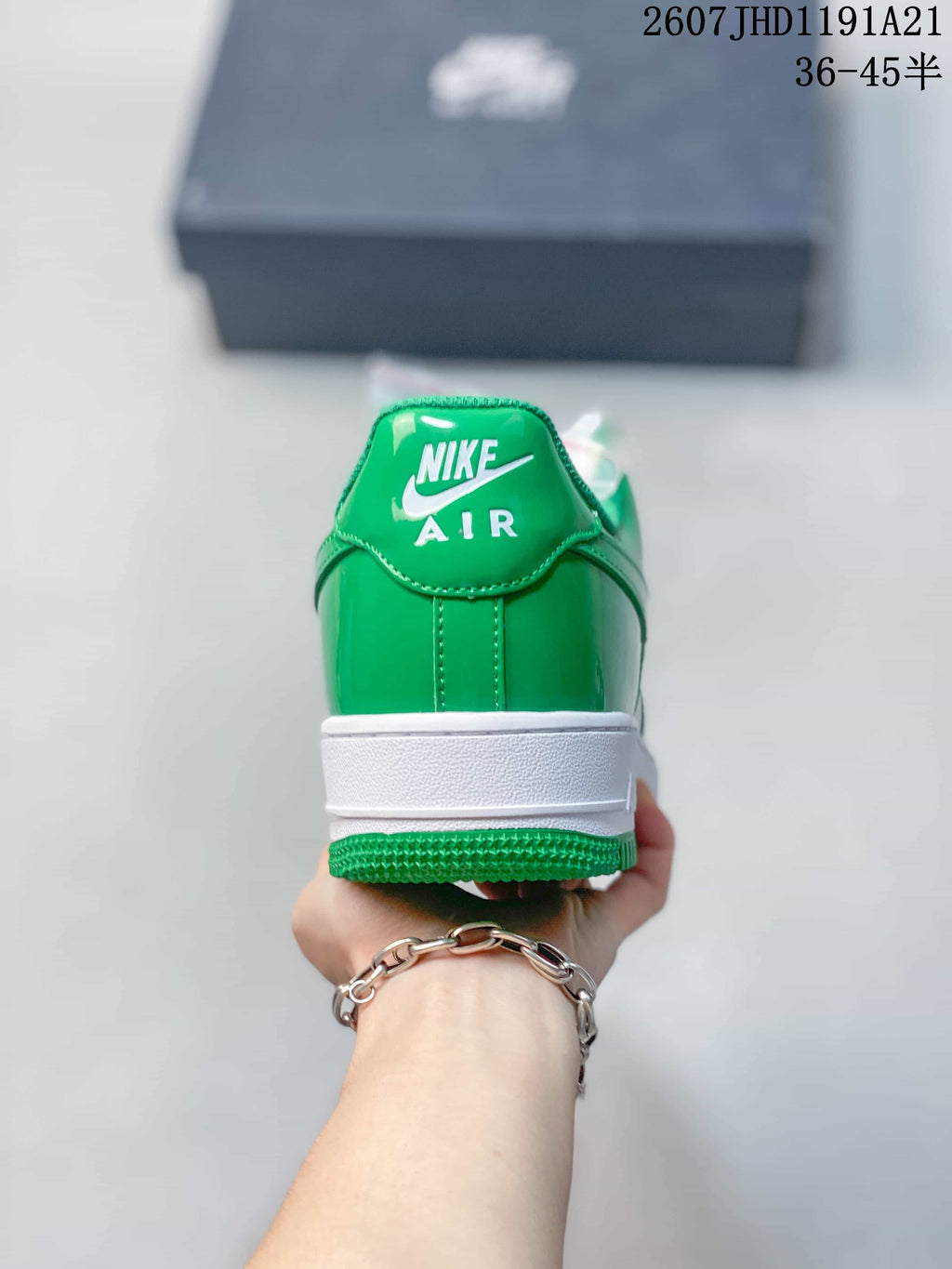 Rear view of the green heel panel, white midsole, and green outsole with Nike Air branding visible.