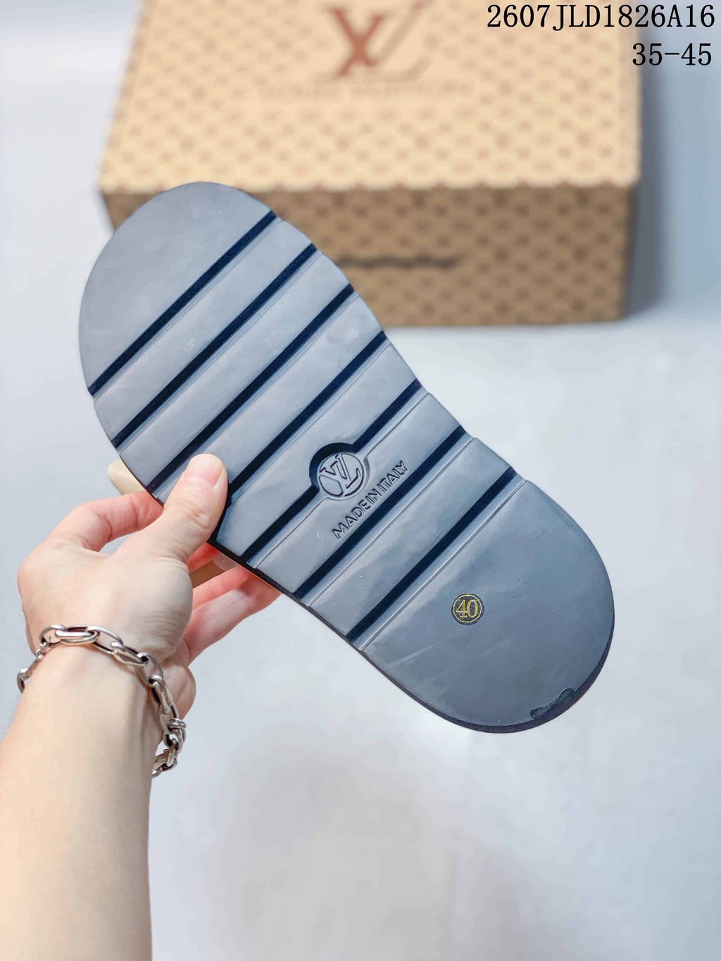Bottom view of a sandal showing the dark ridged outsole, embossed branding, and size 40 marking.