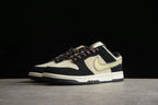 Angled front-side view highlighting the perforated toe box, layered overlays, patterned laces, and Swoosh.