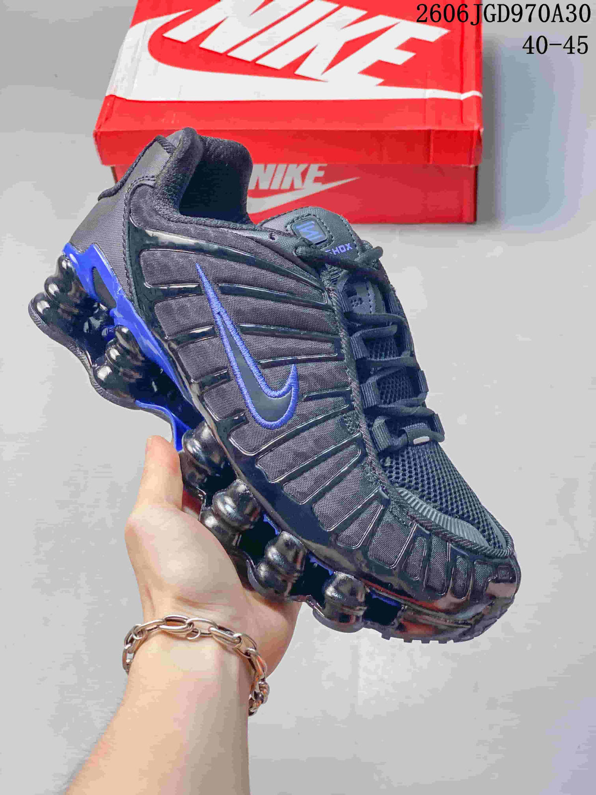 Black Nike Shox TL sneaker with blue accents