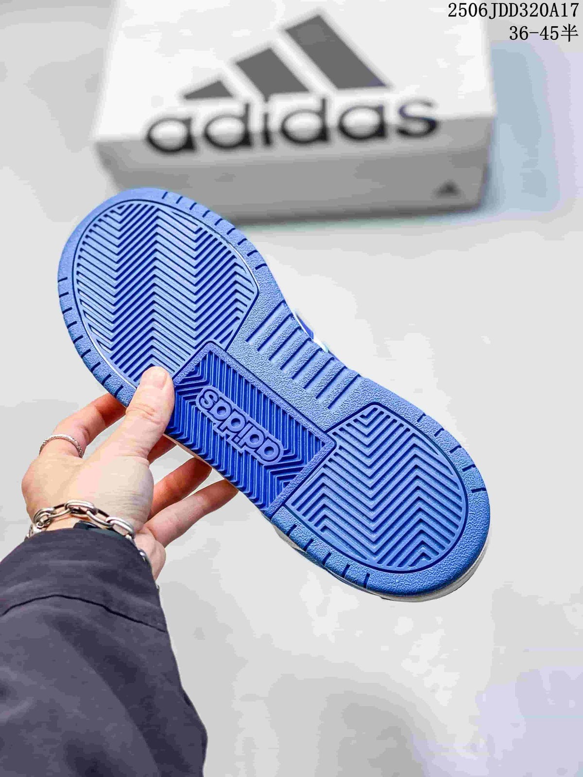Blue patterned rubber outsole of the adidas Entrap sneaker with an adidas shoebox in the background.