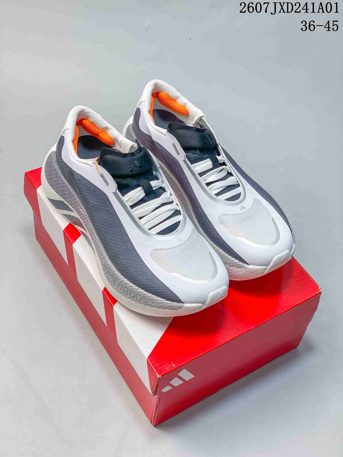 Pair of white and gray Adidas Hyperboost Edge M running shoes on a red box