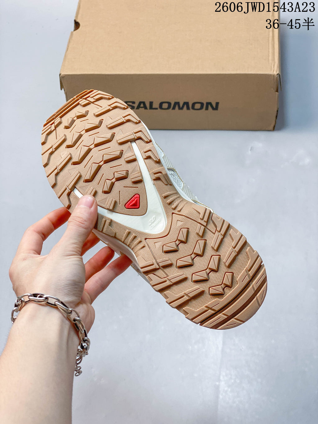 Close-up of the tan-toned lugged outsole