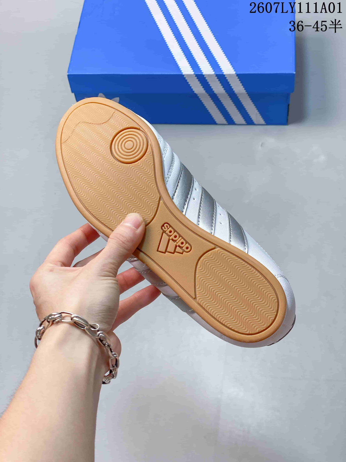 Underside of a sneaker showing a gum-colored outsole with patterned tread.