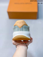 Rear view showing the blue patterned heel, tan heel tab, and white midsole.