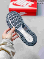 Close view of the sneaker outsole showing a segmented black-and-white tread pattern.