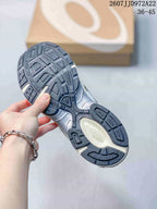 Close view of the sneaker outsole showing a dark tread pattern and layered sole construction; image text shows style code JJD972A22 and size range 36–45.