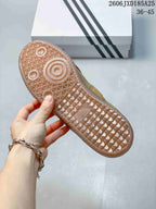 Close view of the translucent gum-colored outsole with geometric textured tread.