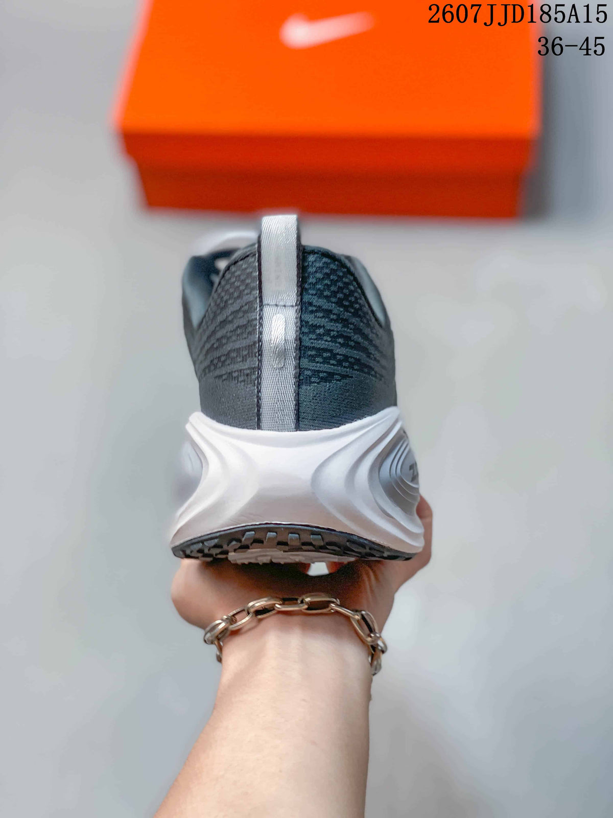 Rear view showing the padded heel, vertical pull tab, and white sculpted midsole.