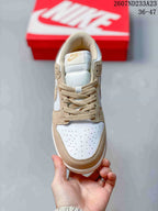 Top view showing the perforated white toe box, beige overlays, and tonal laces.