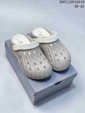 Pair of off-white ribbed closed-toe clog sandals with white straps, displayed on a shoebox; image text shows style code 2607JJD516A16 and size range 38–45.