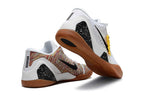 White shoes with gum-colored outsoles shown from the heel and outsole.