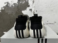 Rear view of black, white, and red adidas basketball shoes