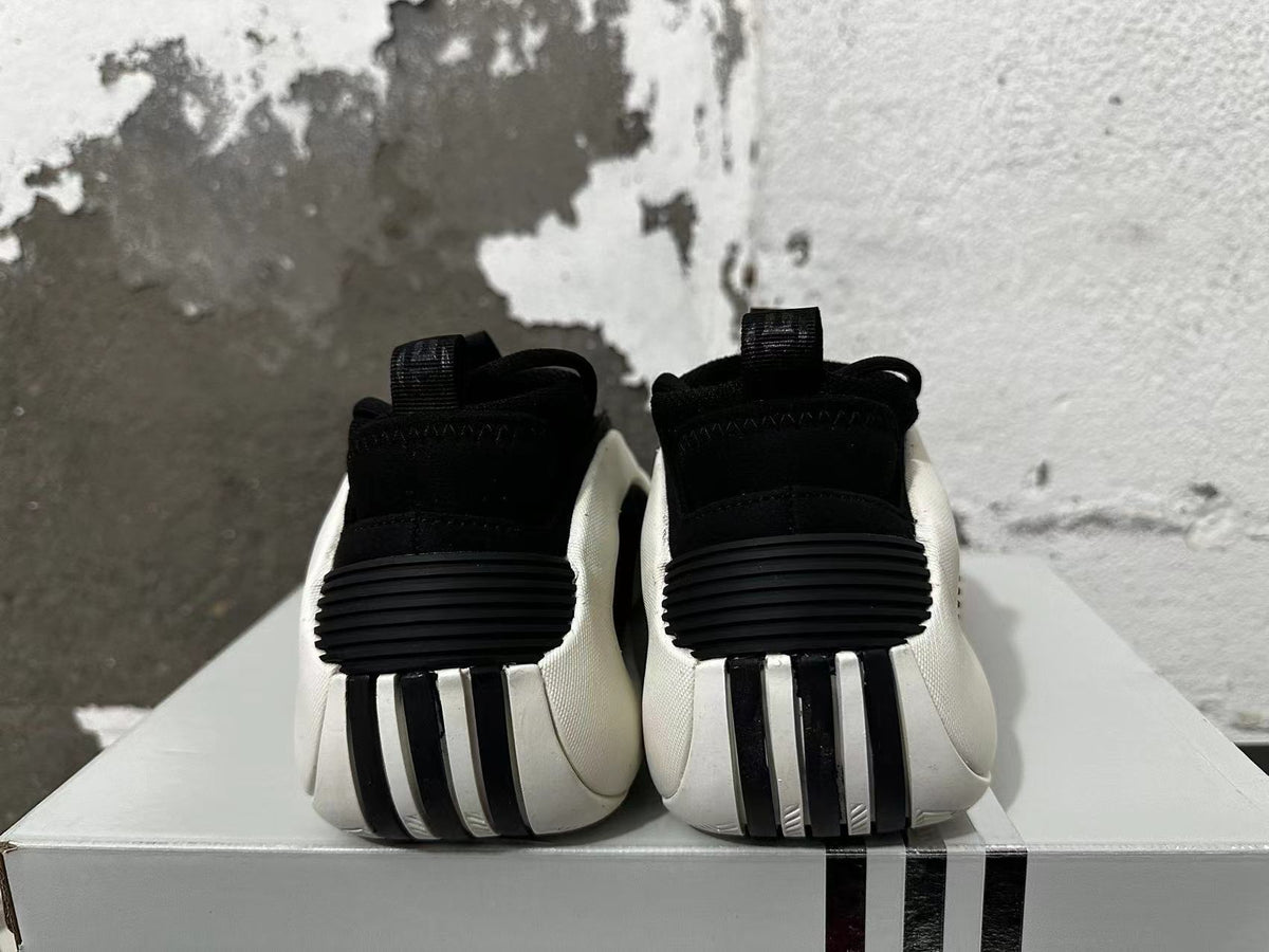 Rear view of black, white, and red adidas basketball shoes