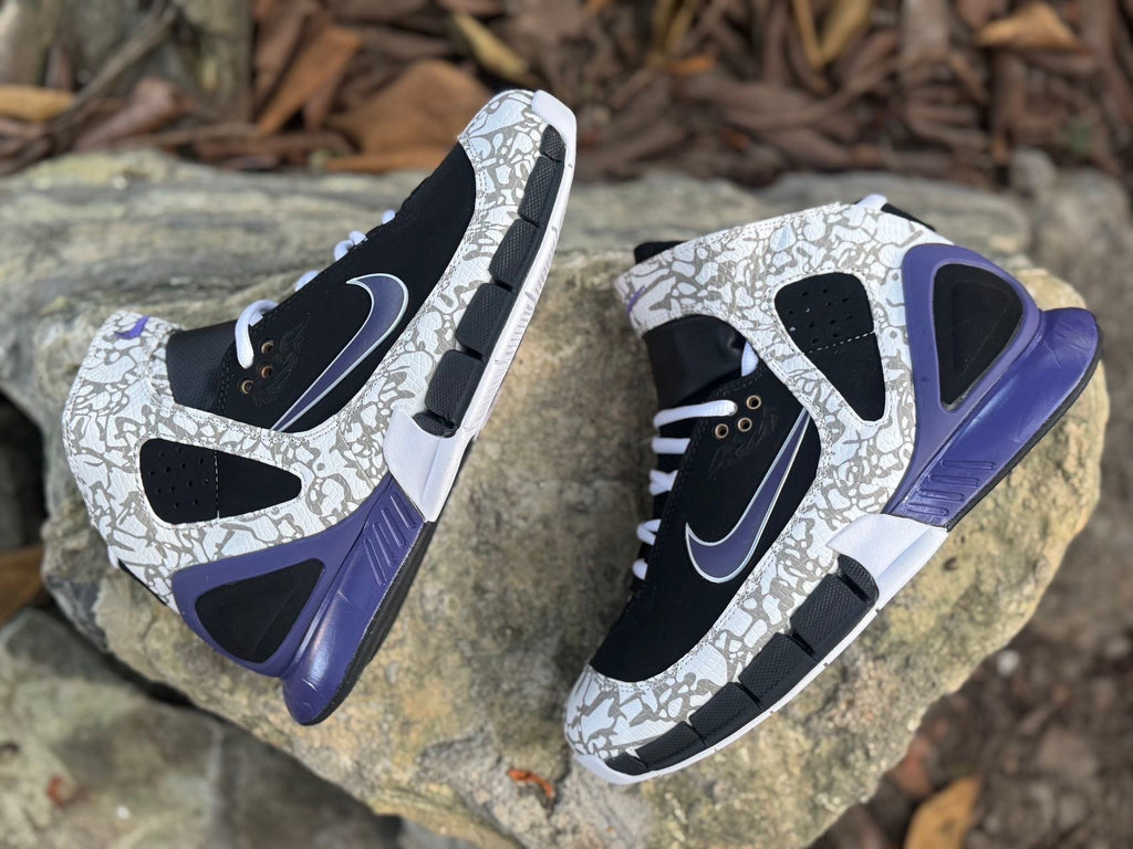 Top and side view of the high-top pair with ankle straps and purple-blue heel accents
