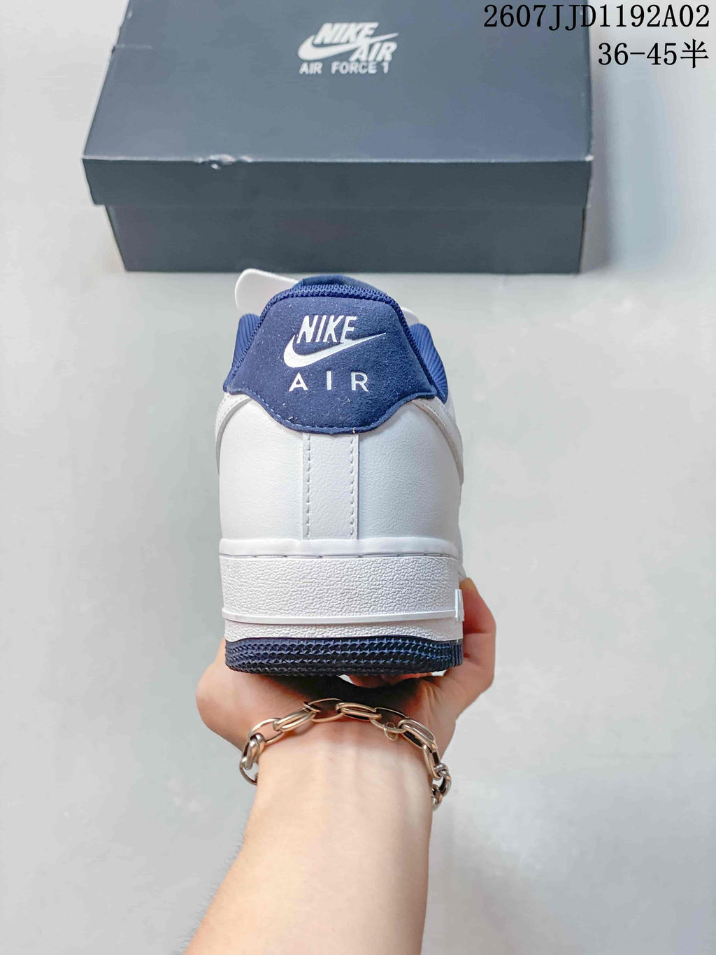 Rear view showing the white heel and navy Nike Air branding