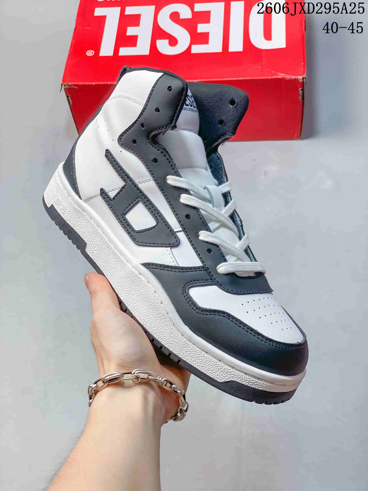 White Diesel S-Ukiyo high-top sneaker with dark gray accents.